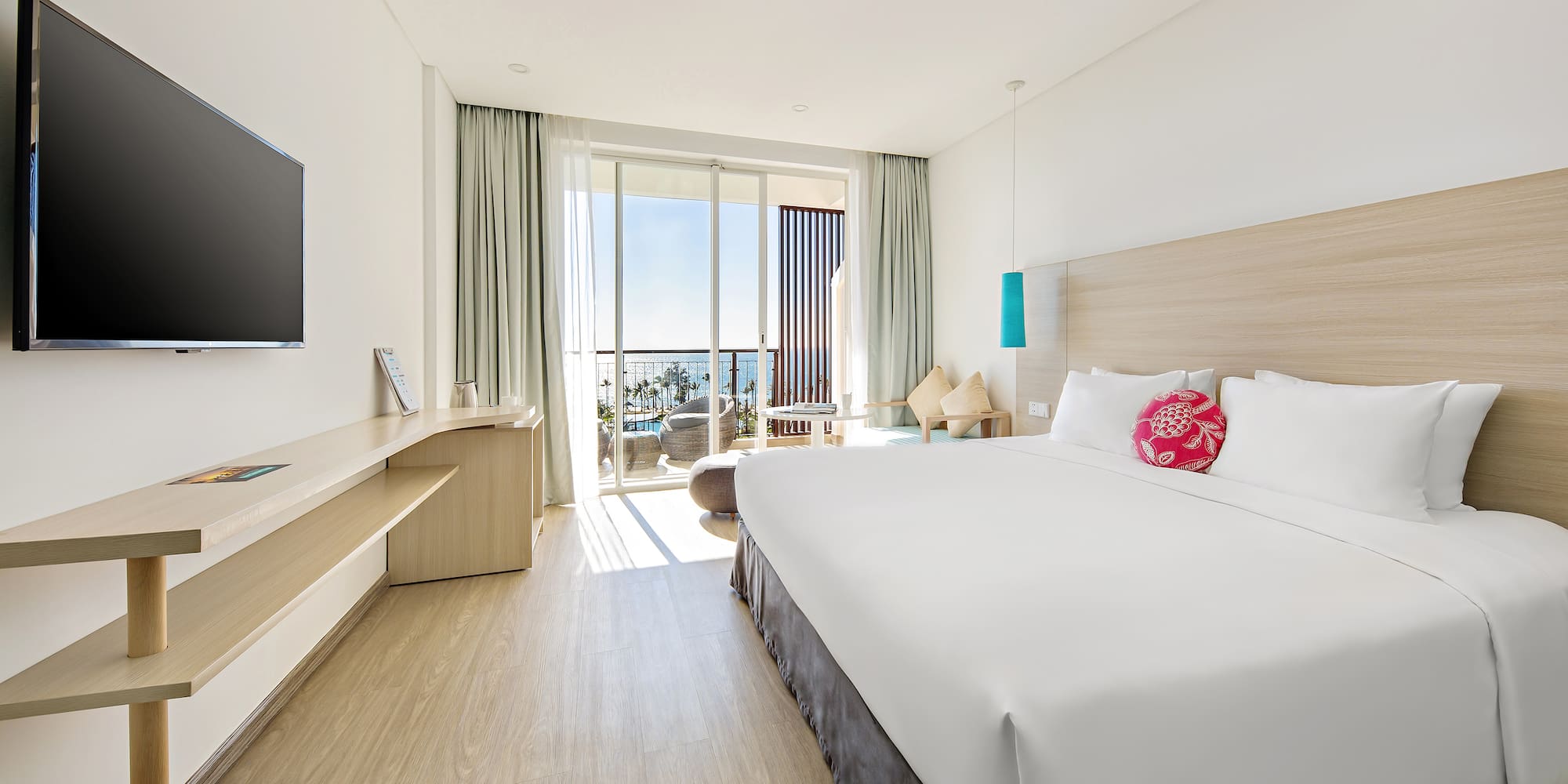 a room with a bed and a television