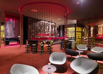 a room with chairs and tables