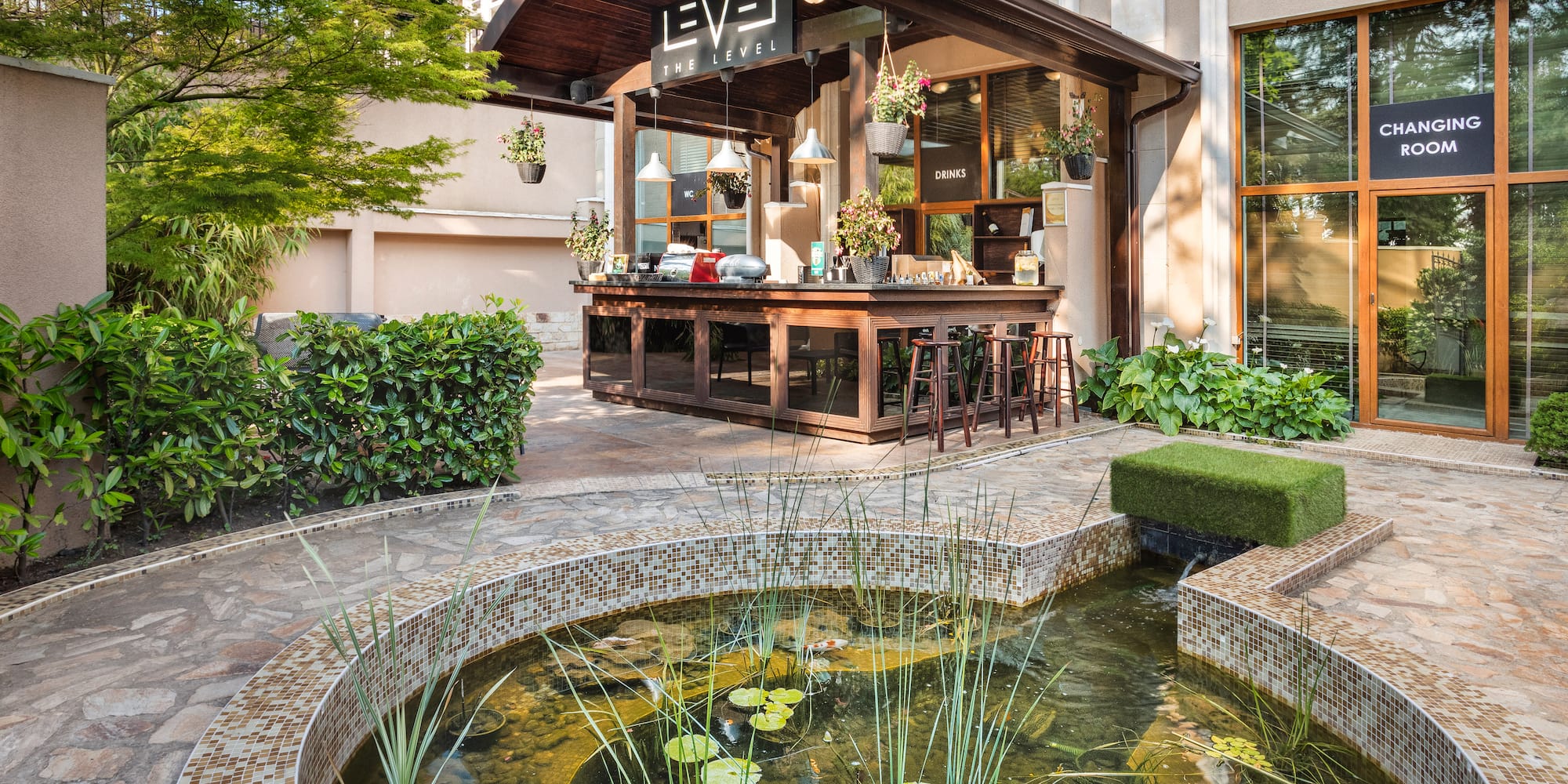 a pond in front of a building