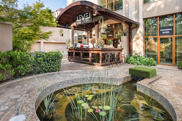 a pond in front of a building