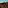 a rocky mountains with a blue sky