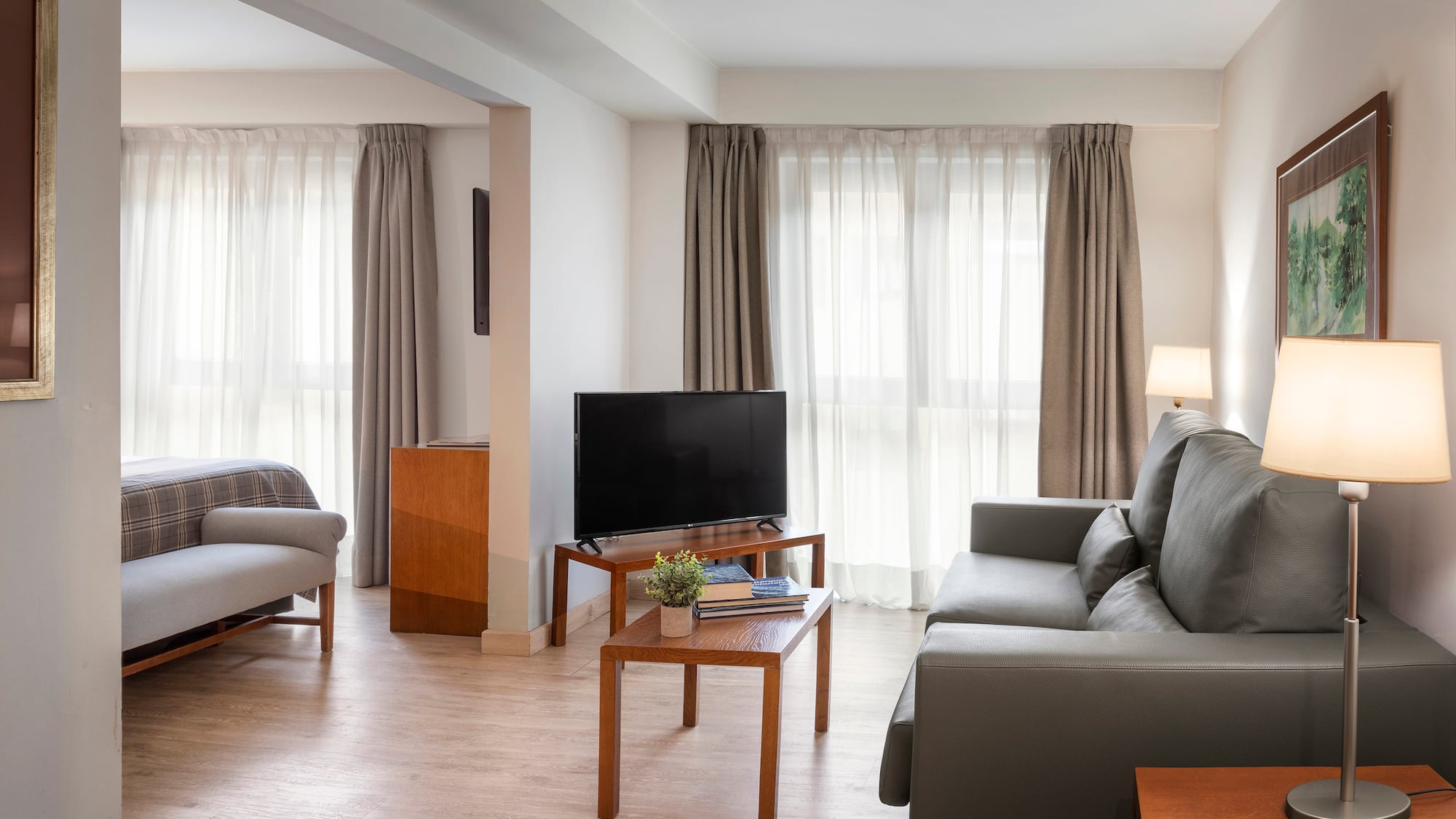 a living room with couches and a tv