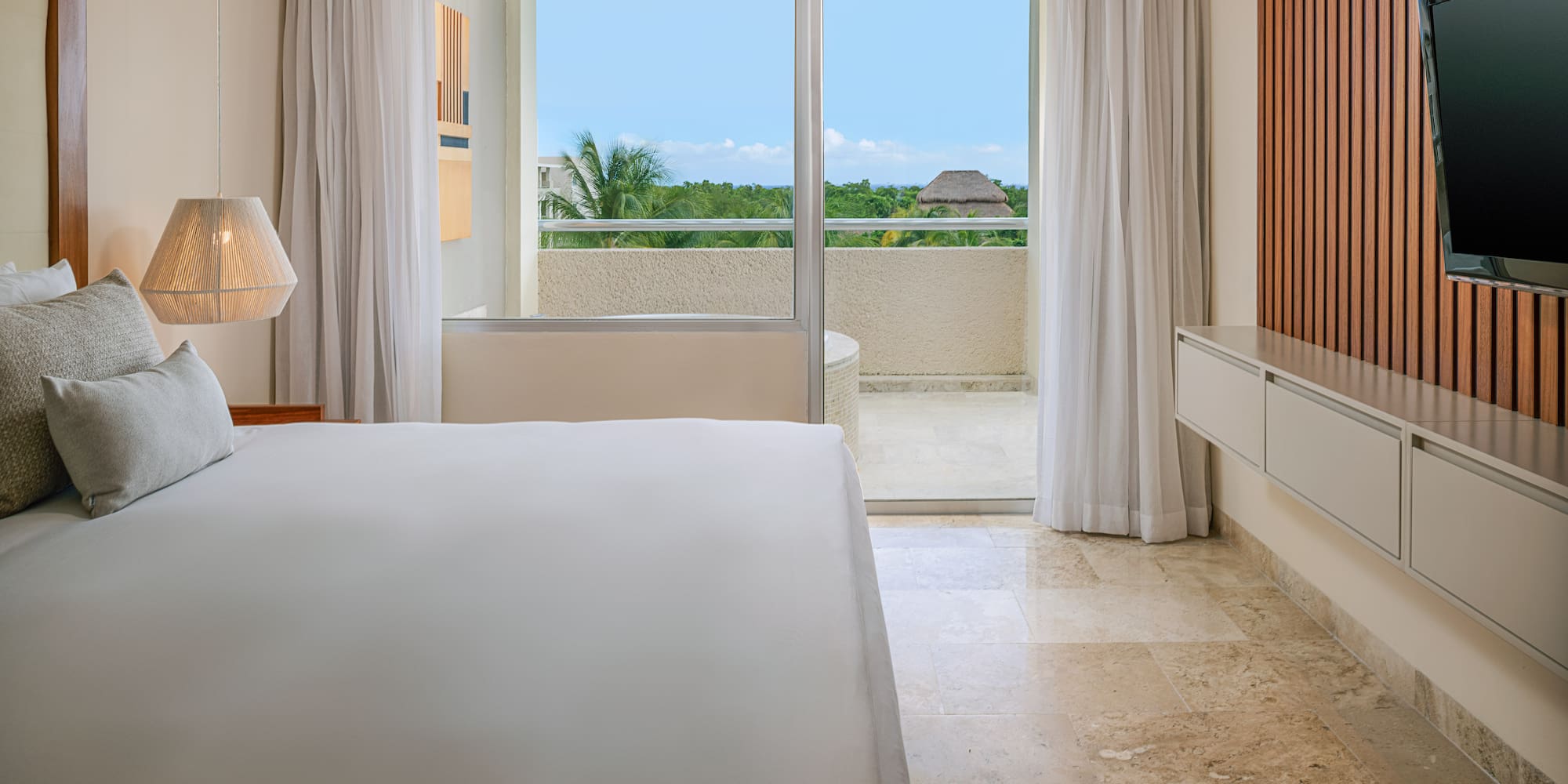 a bedroom with a large window