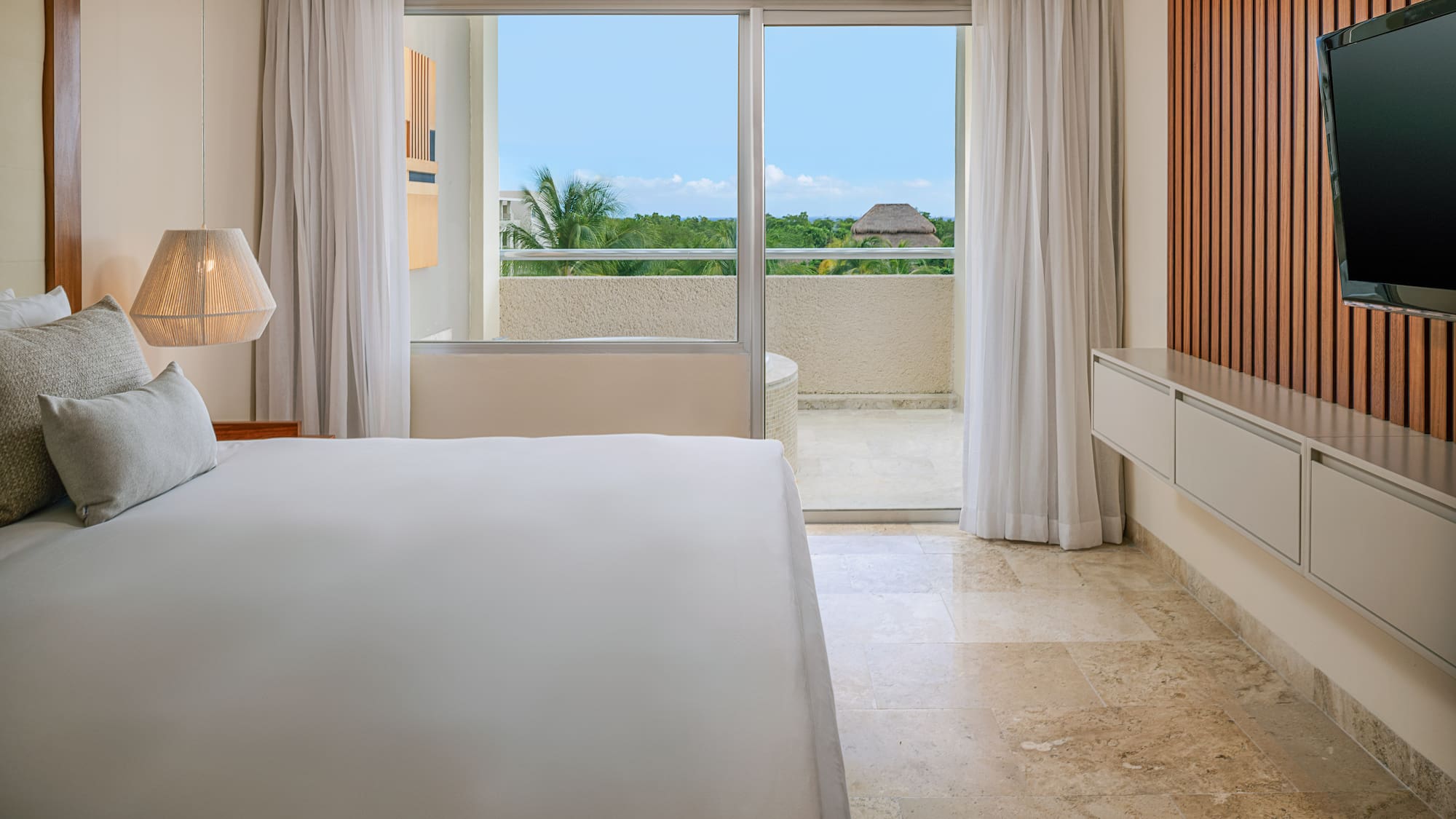 a bedroom with a large window