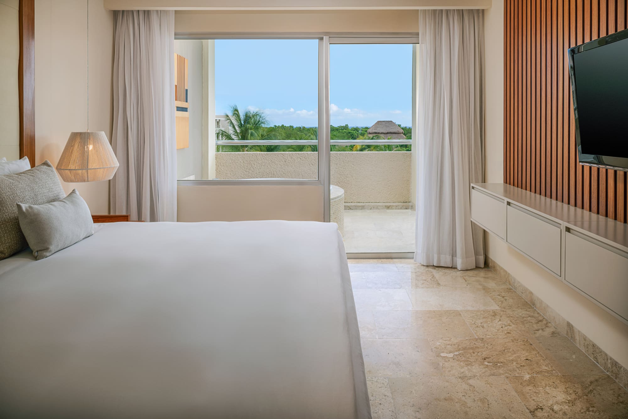 a bedroom with a large window