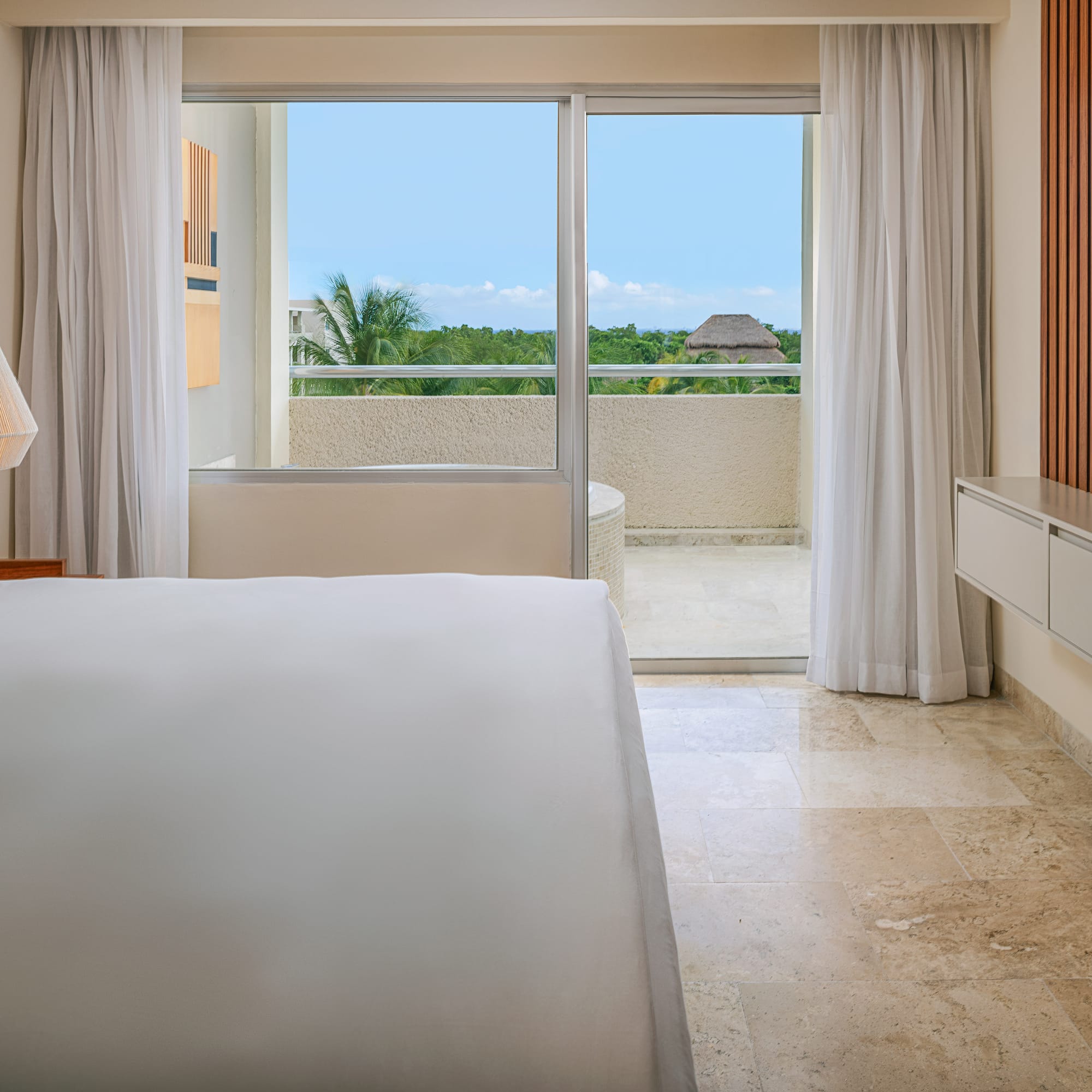 a bedroom with a large window