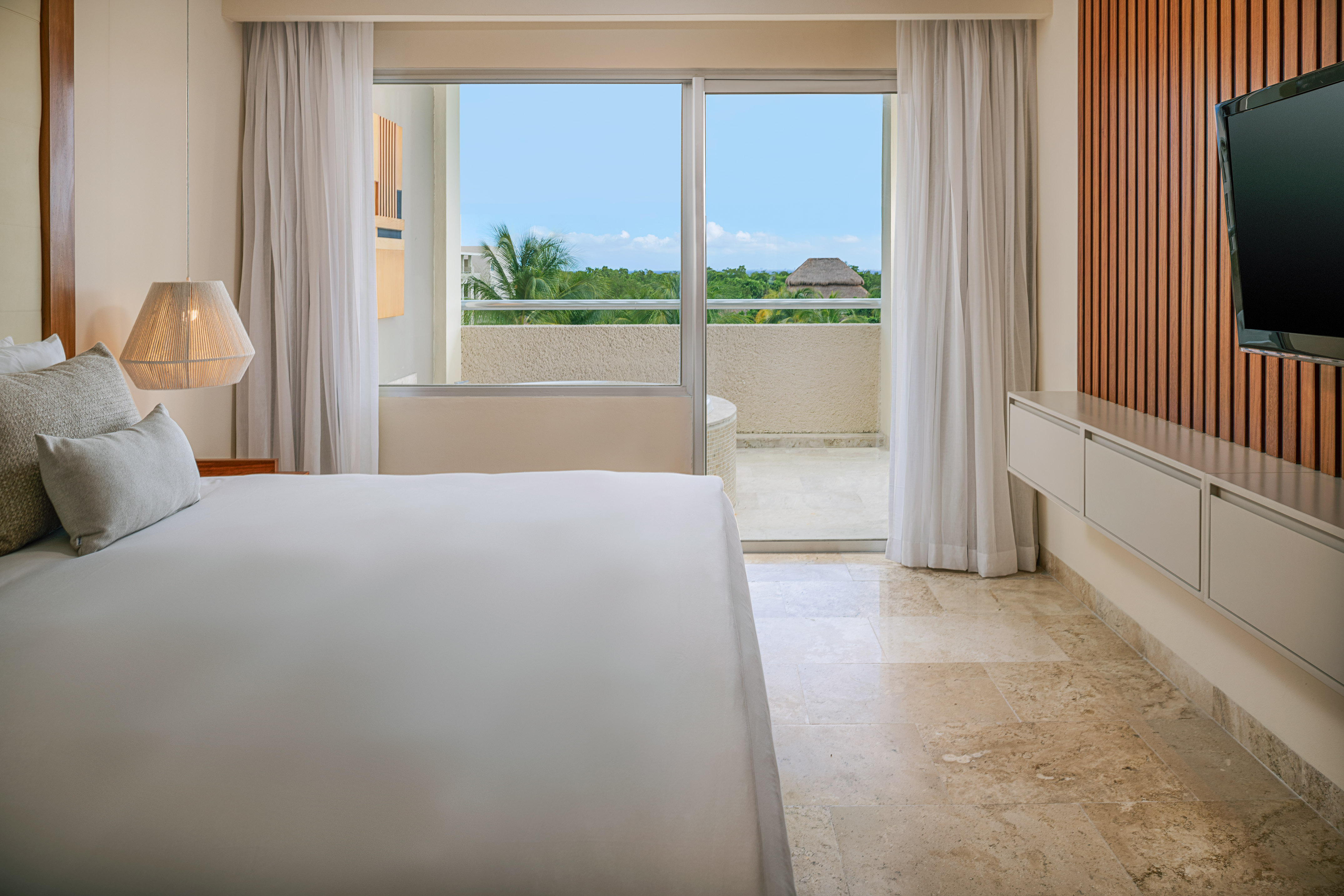 a bedroom with a large window