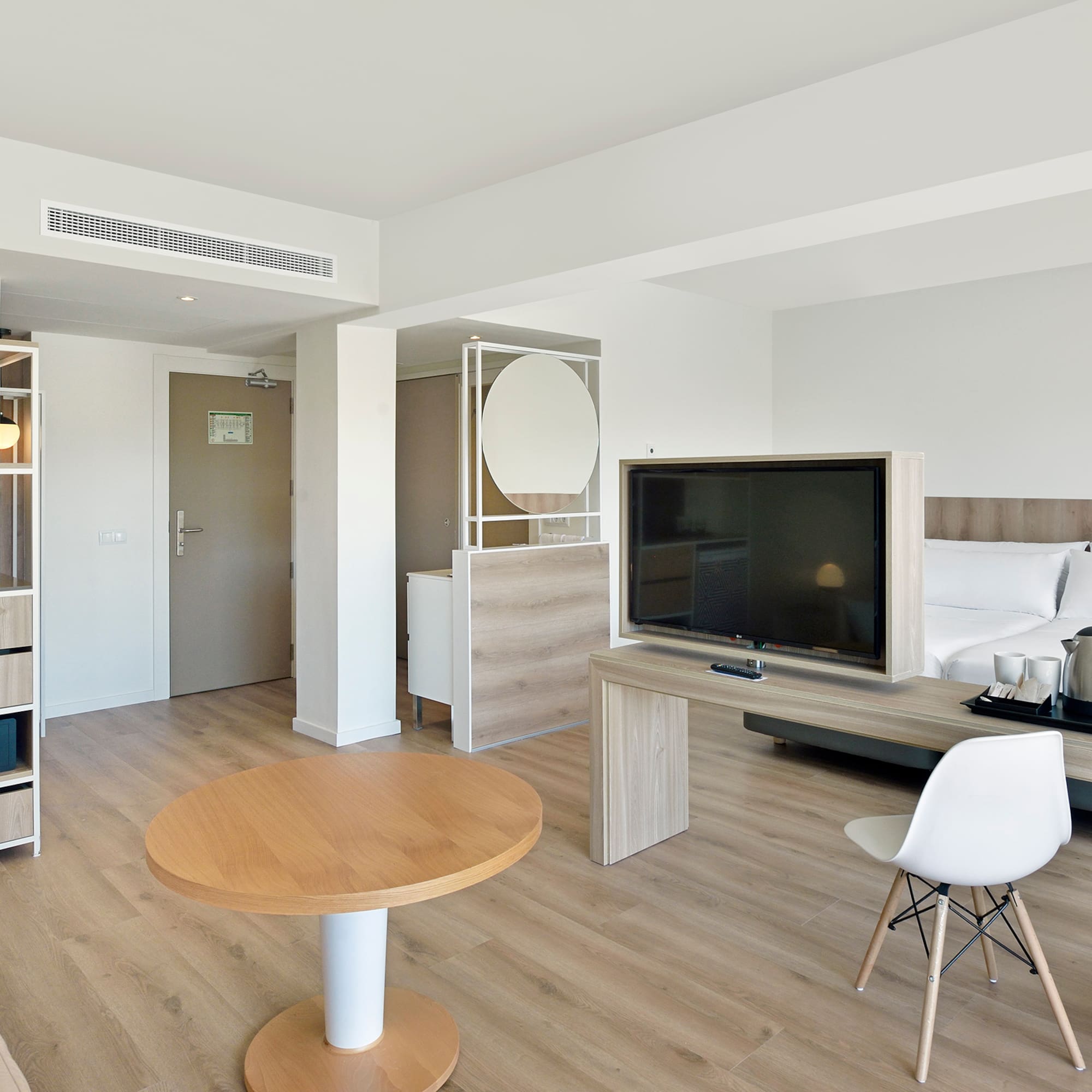 a room with a television and a bed