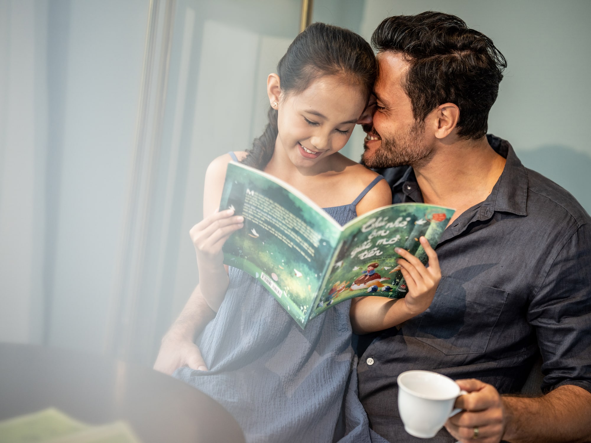 a man and a girl reading a book