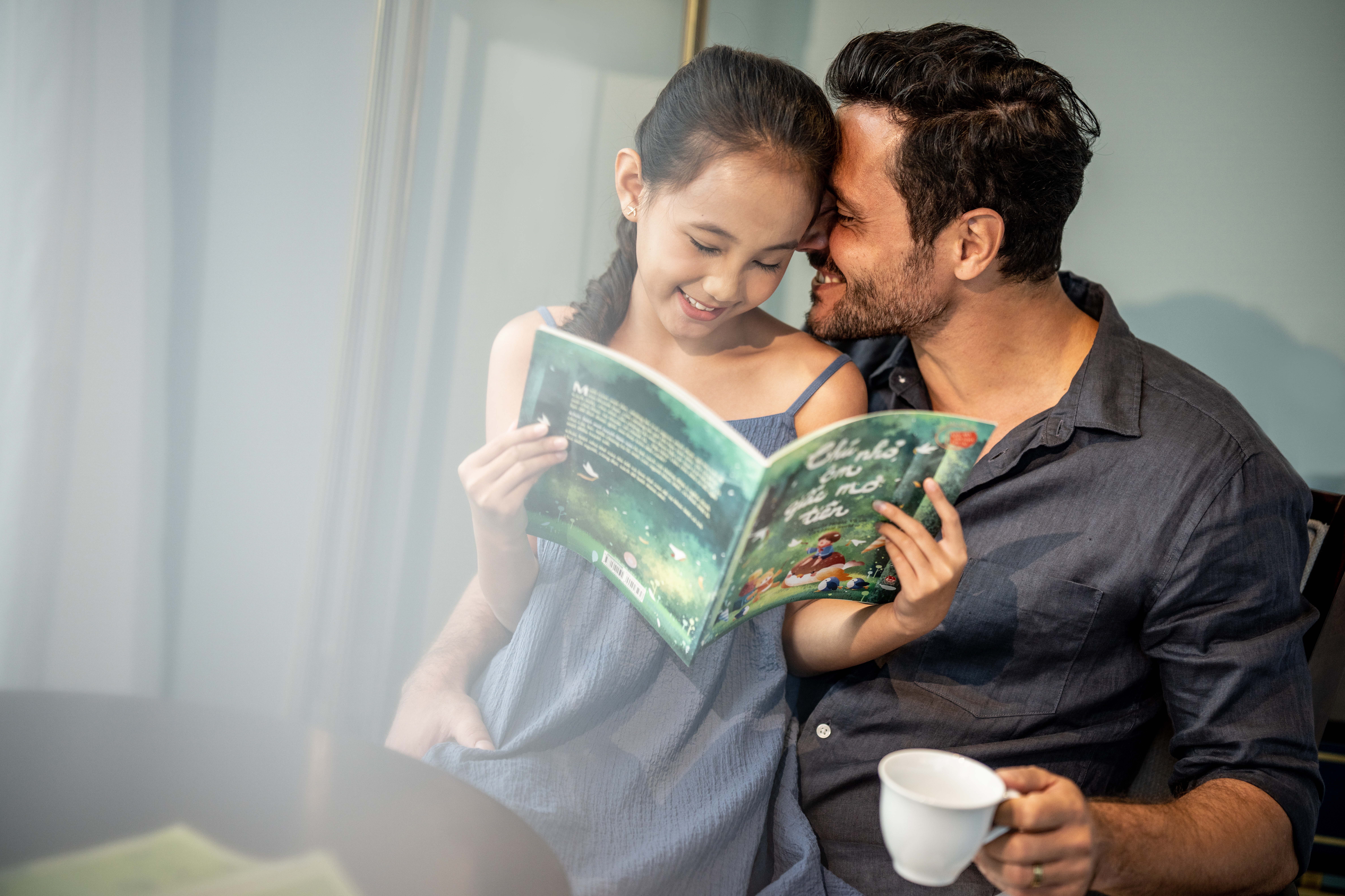 a man and a girl reading a book