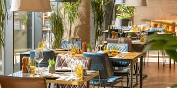 a restaurant with tables and chairs