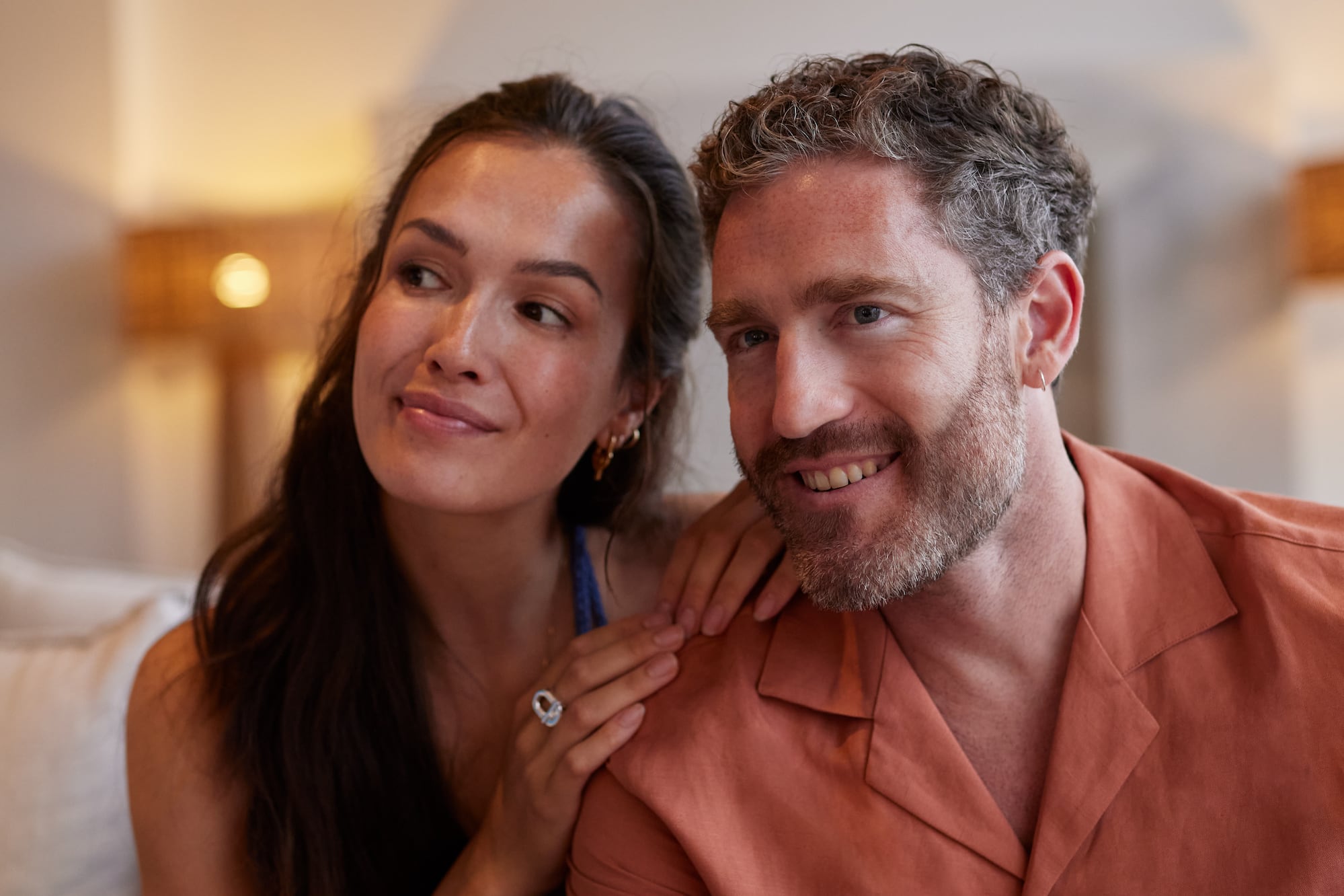 a man and woman sitting on a couch