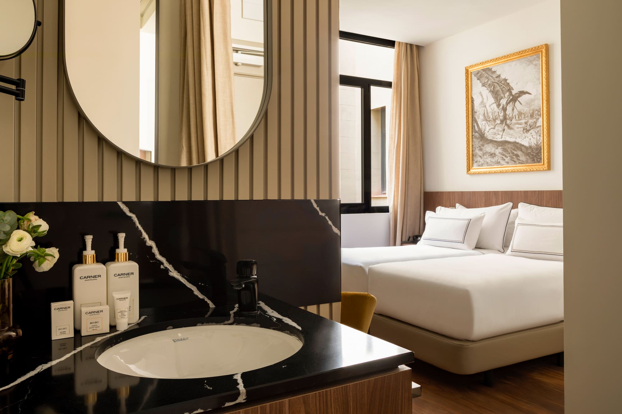 a bathroom with a mirror and a bed