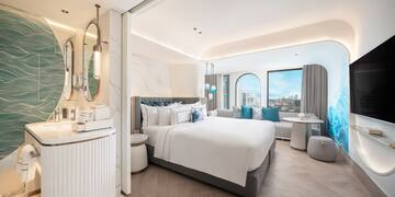 a room with a bed and a mirror