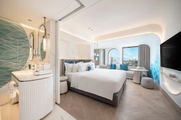 a room with a bed and a mirror