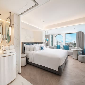 a room with a bed and a mirror