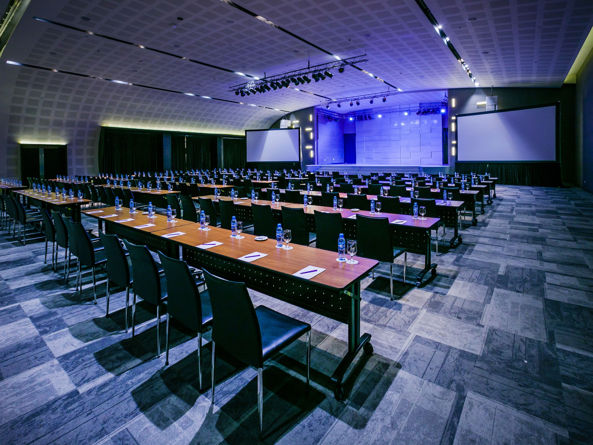 a large conference room with tables and chairs