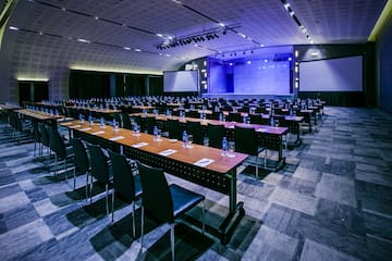 a large conference room with tables and chairs