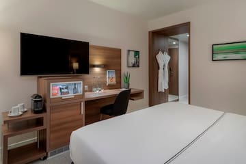 a room with a bed and a desk