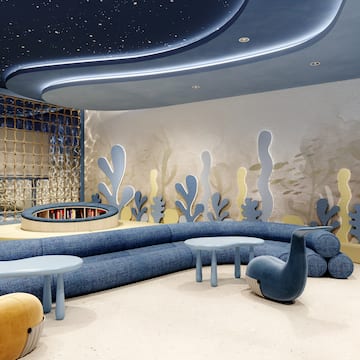 a room with a couch and tables