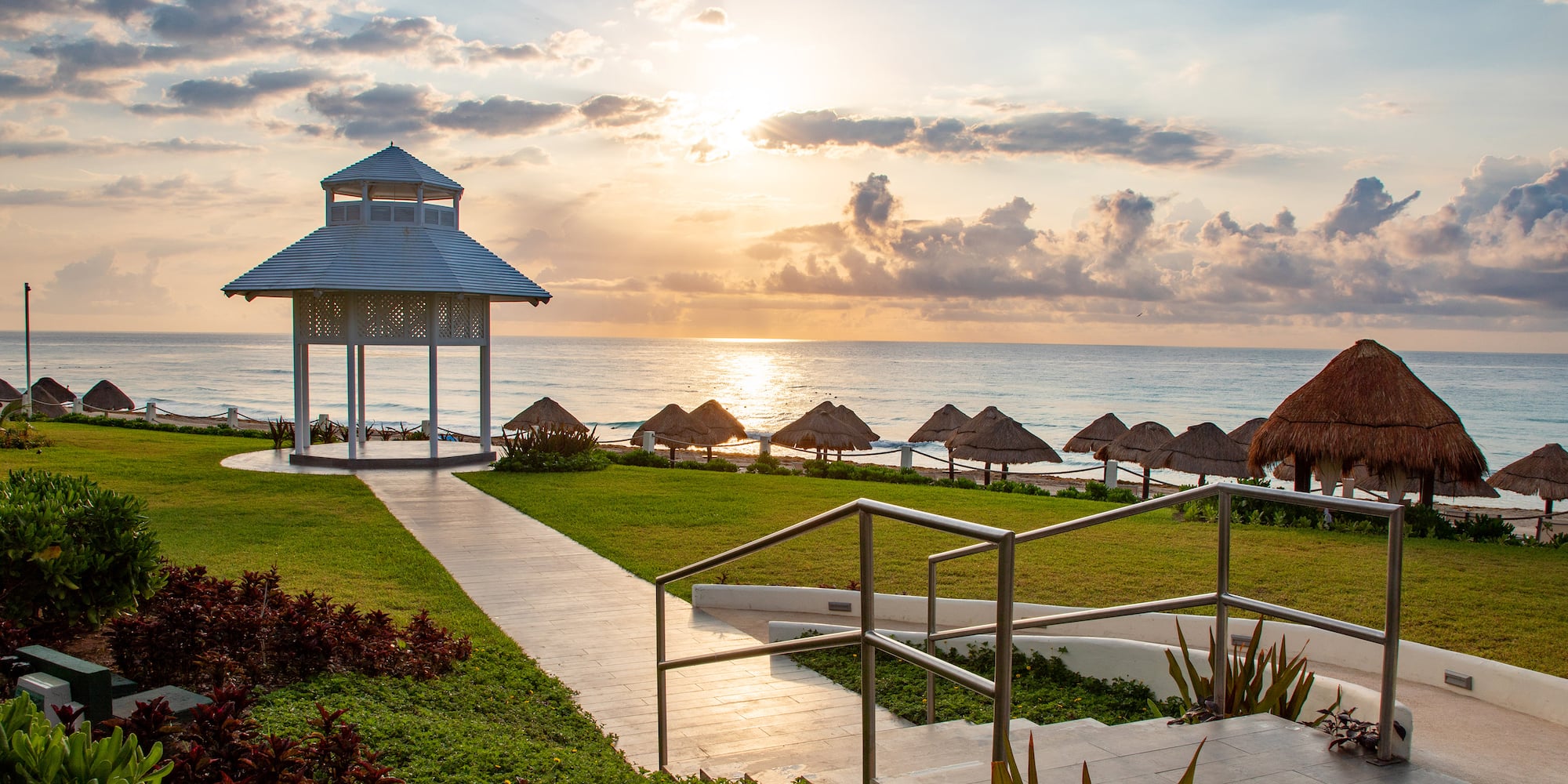 a gazebo next to a beach