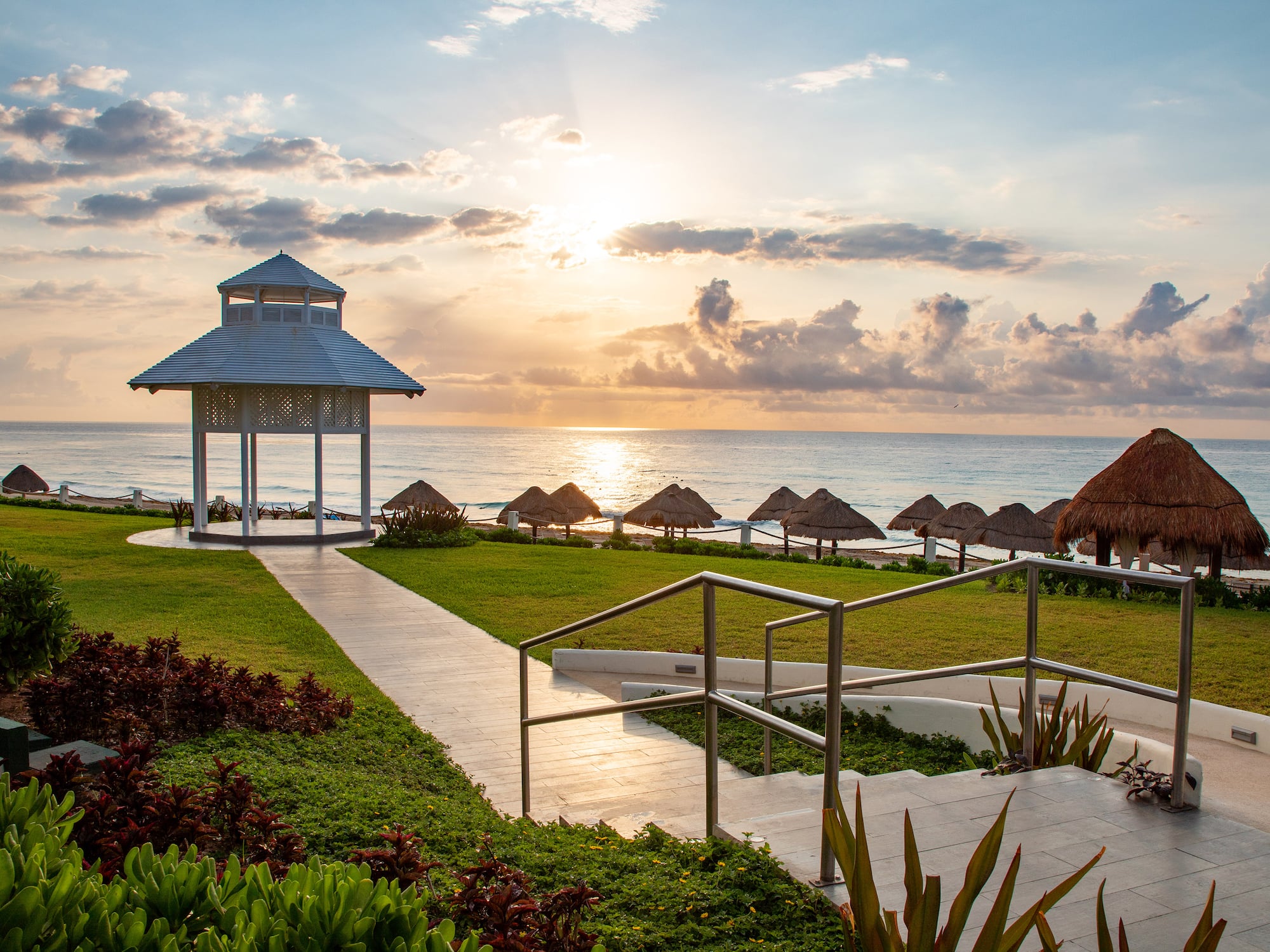 a gazebo next to a beach