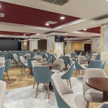 a room with tables and chairs