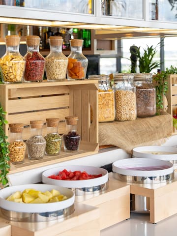 a variety of food in containers on a counter