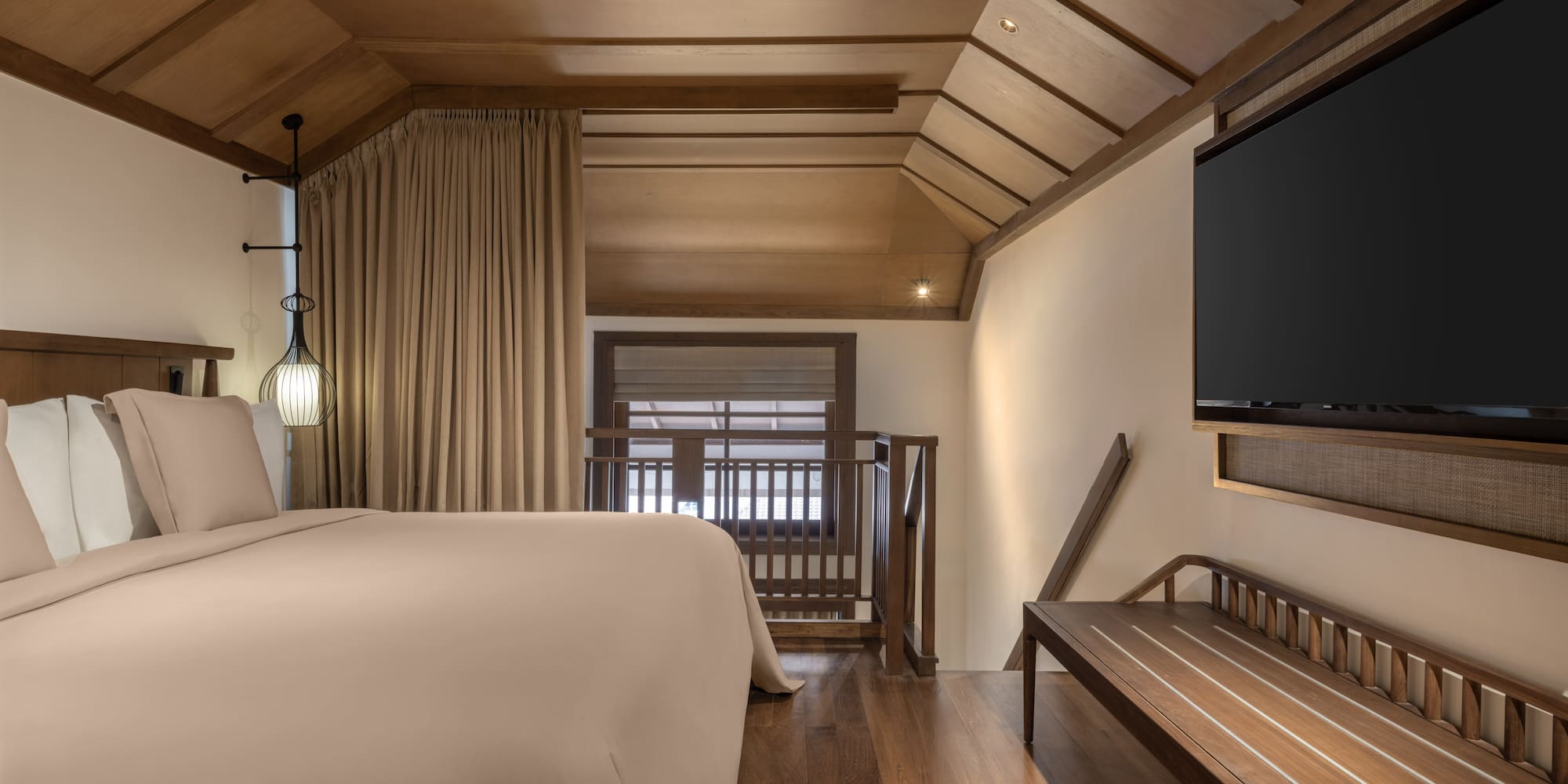 a room with a bed and a bench