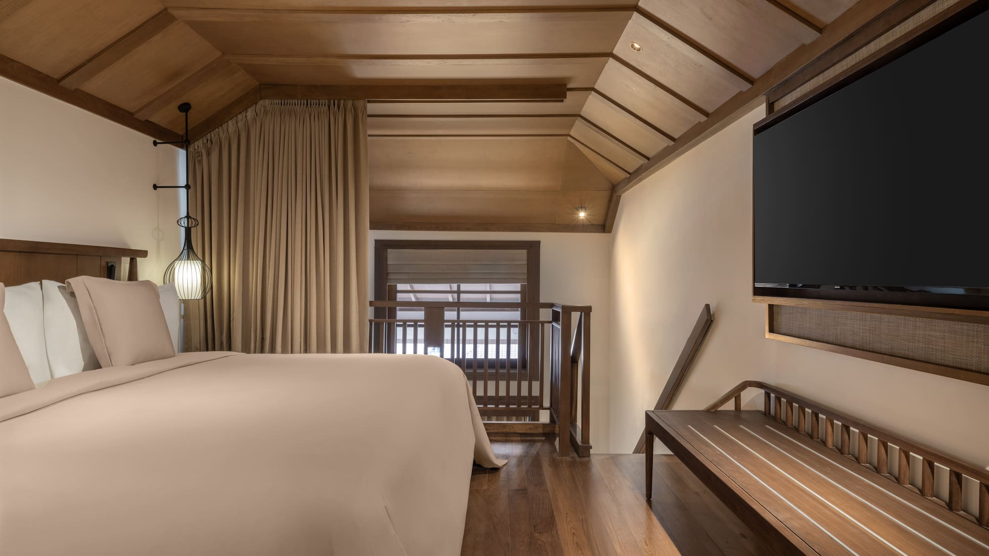 a room with a bed and a bench