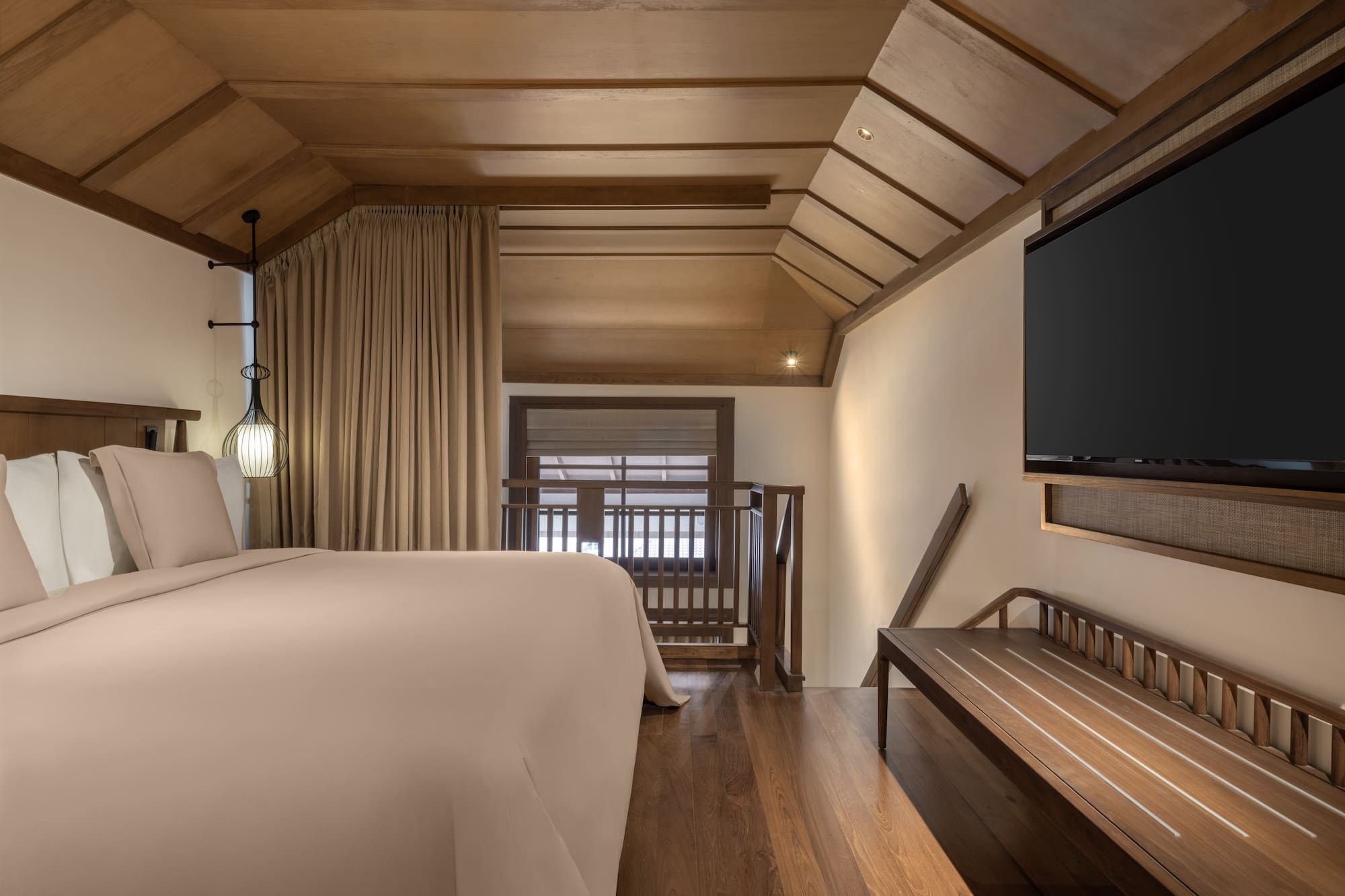 a room with a bed and a bench