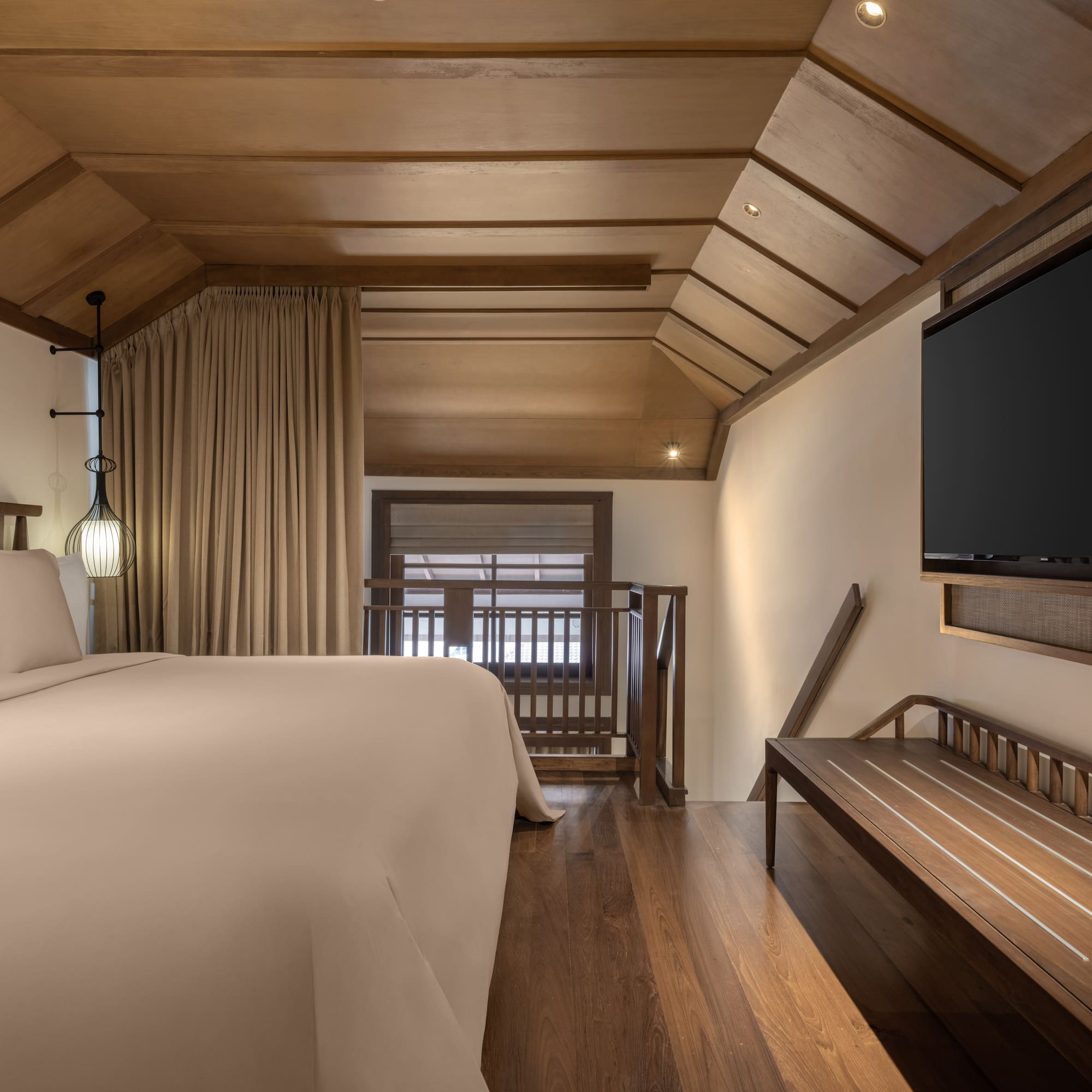 a room with a bed and a bench