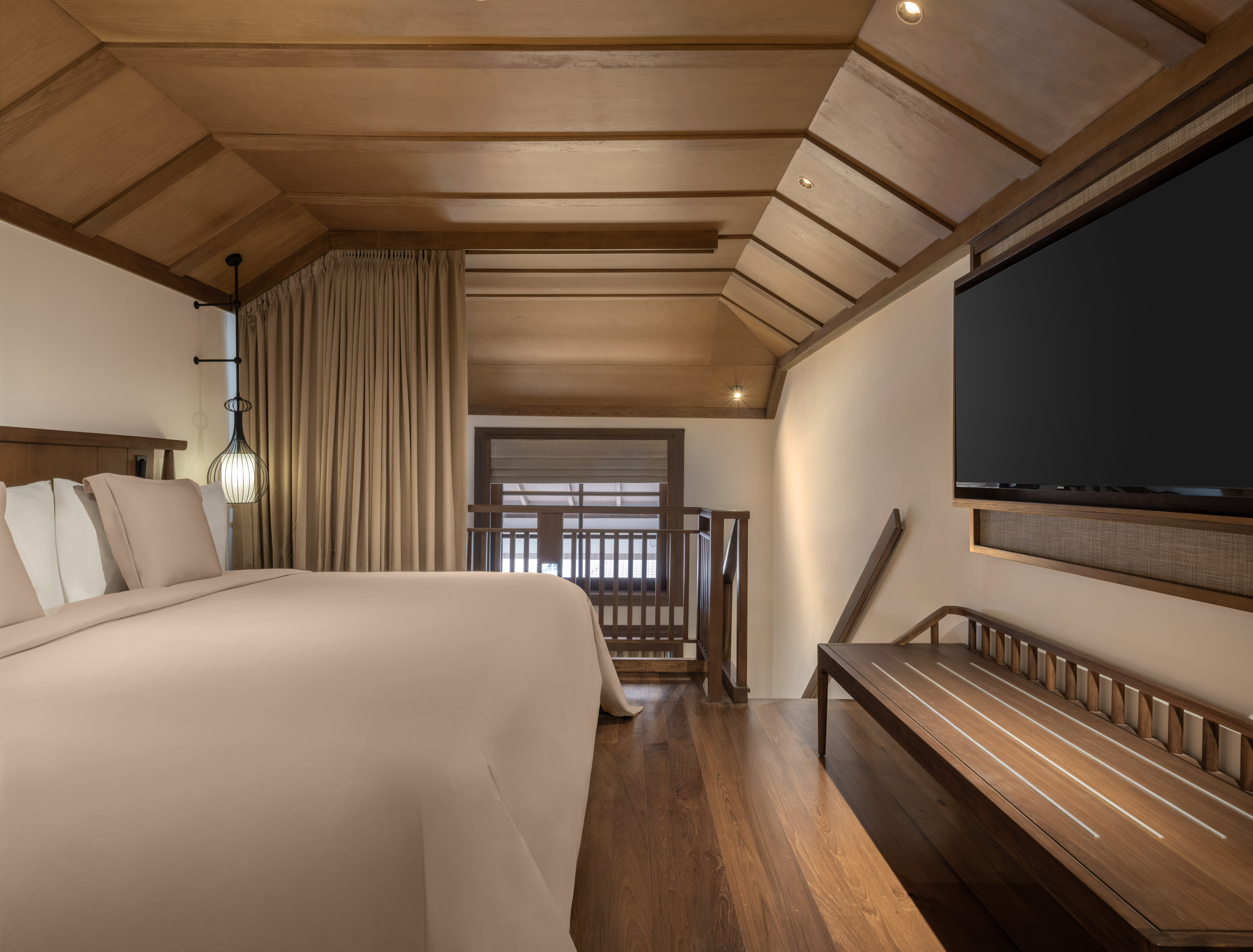 a room with a bed and a bench