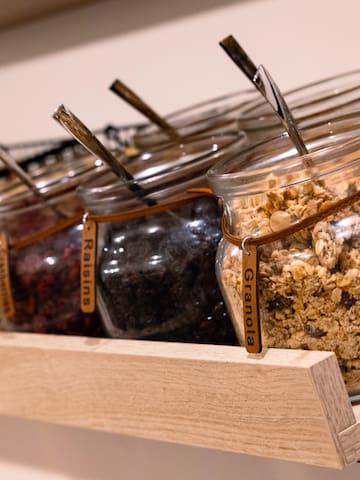 a group of glass jars with food in them