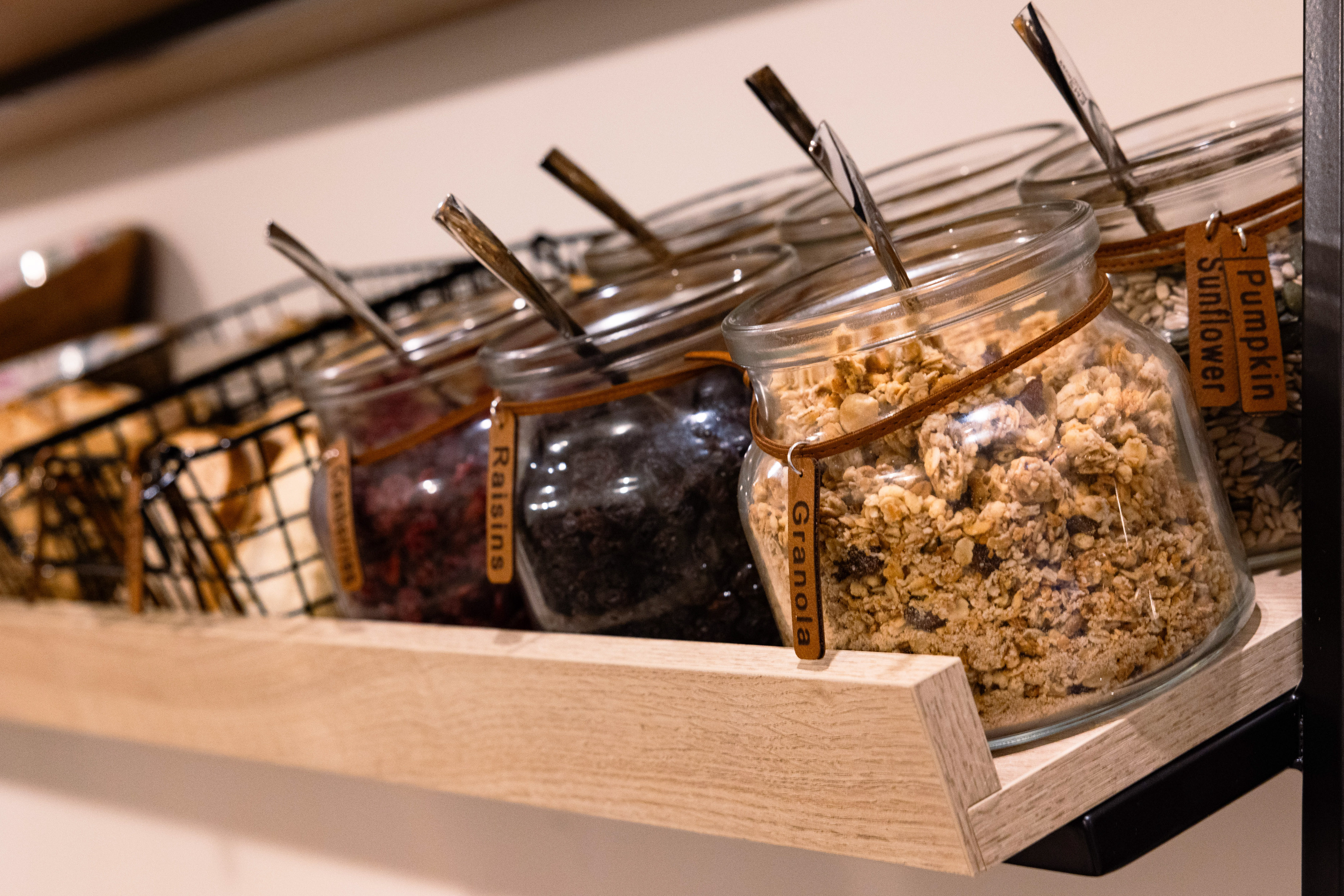 a group of glass jars with food in them