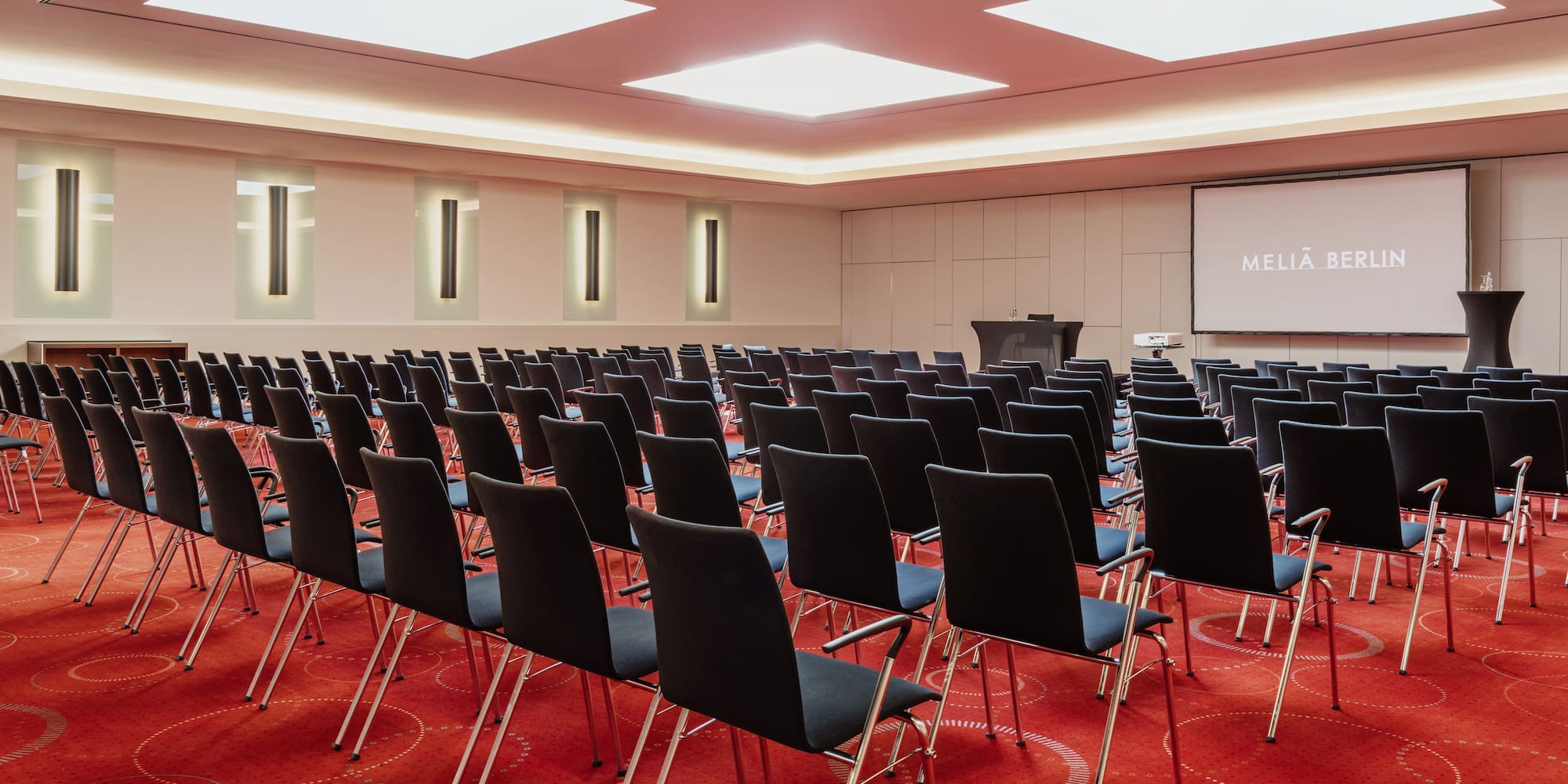 a room with rows of chairs