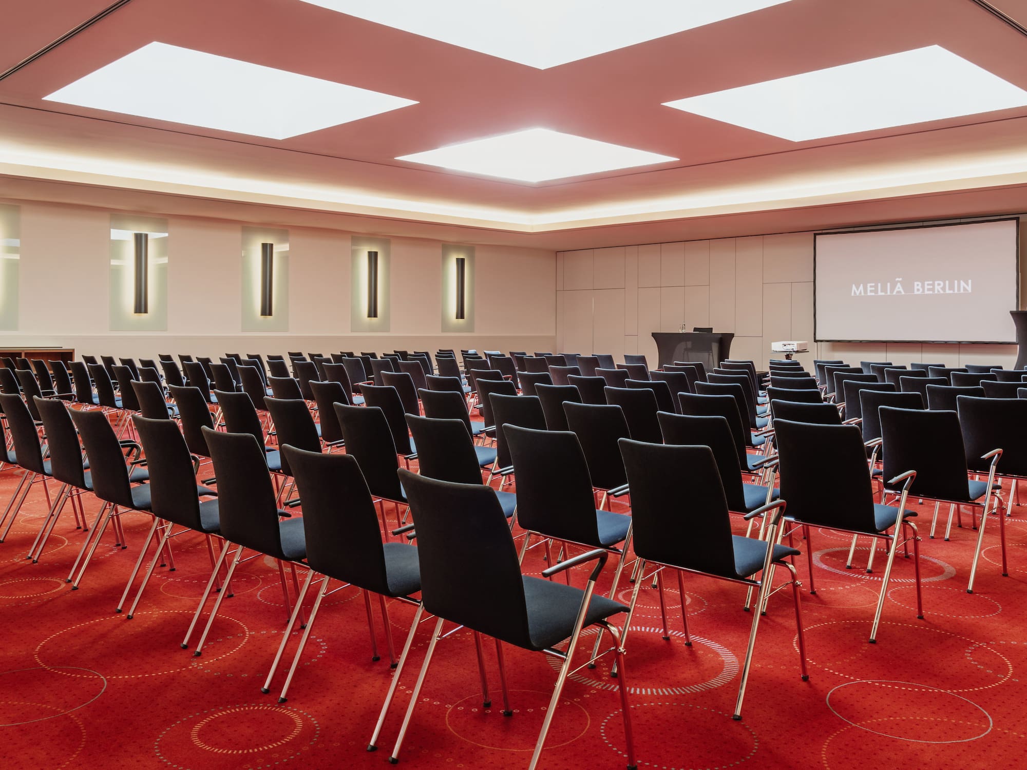 a room with rows of chairs