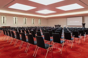 a room with rows of chairs