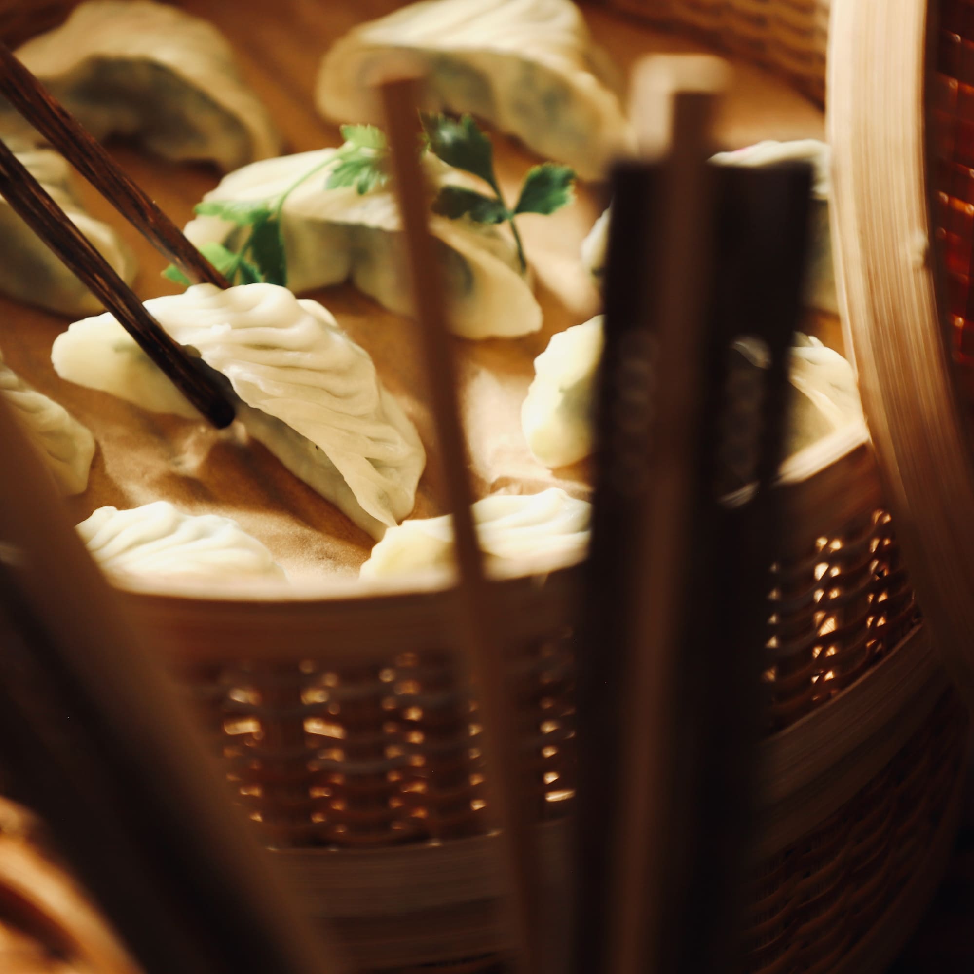 a basket of food with chopsticks