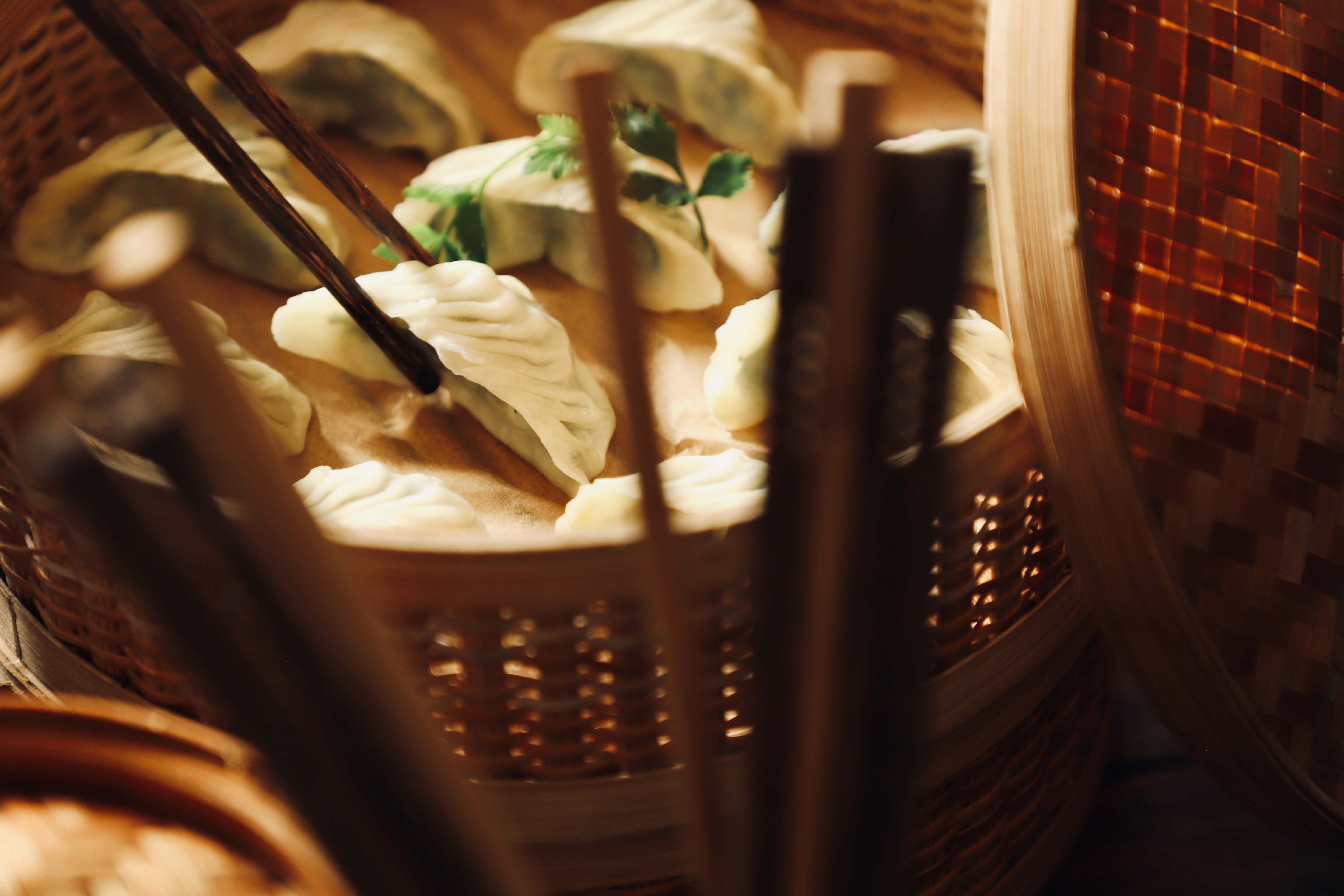 a basket of food with chopsticks