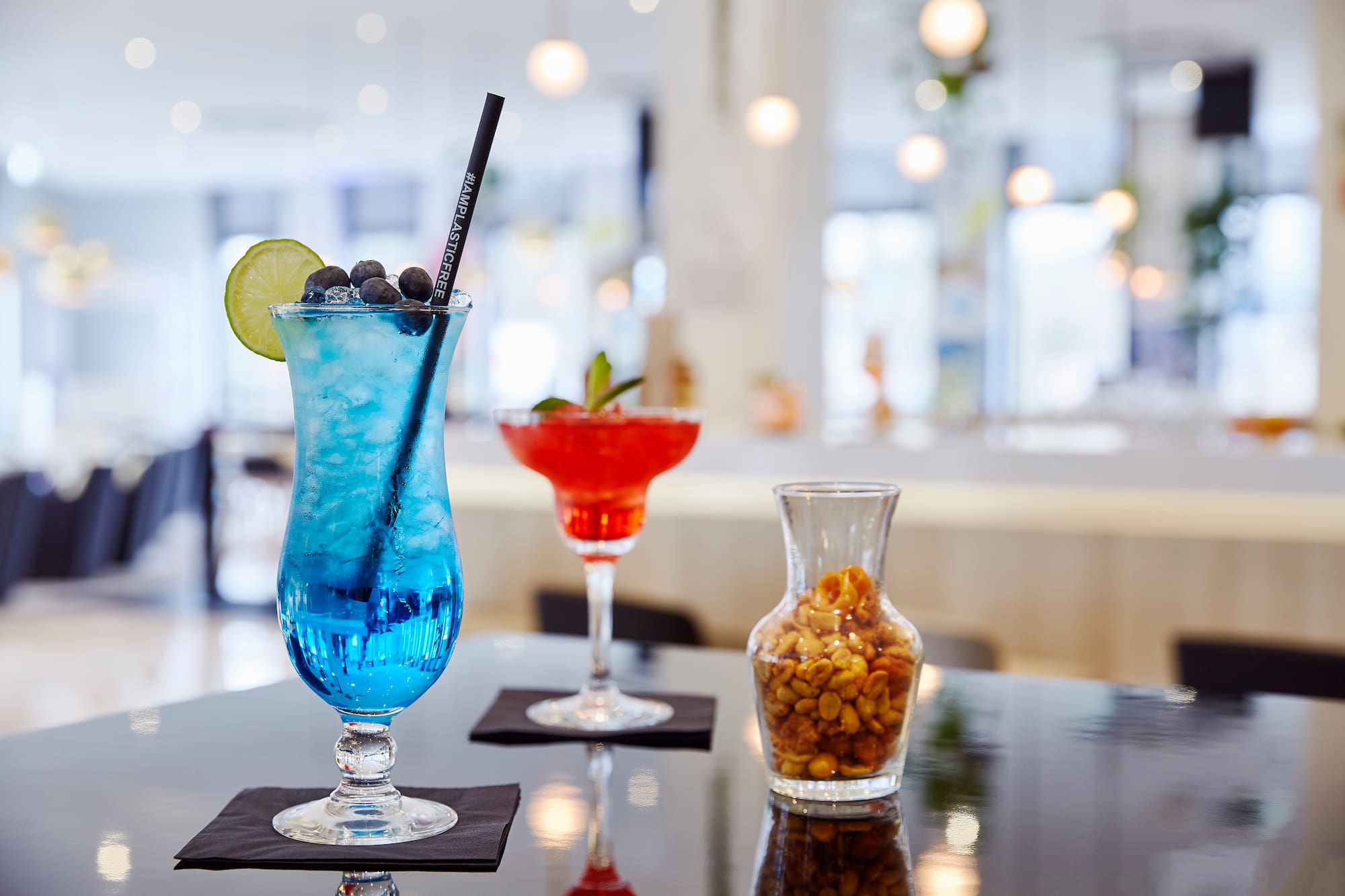 a blue and red drink on a table