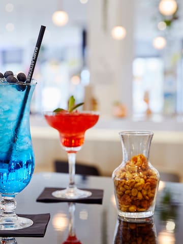 a blue and red drink on a table