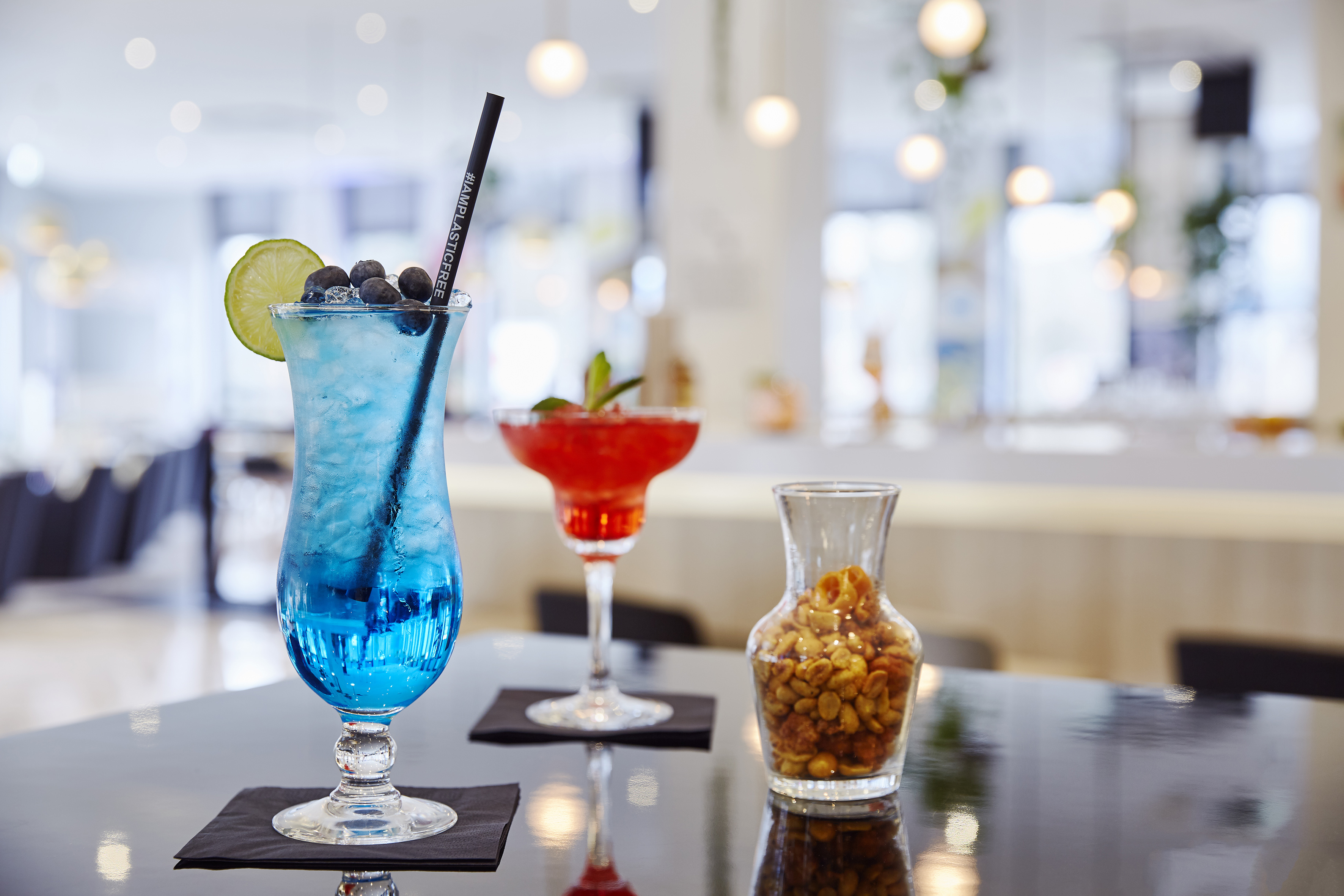 a blue and red drink on a table