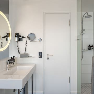 a bathroom with a mirror and sink