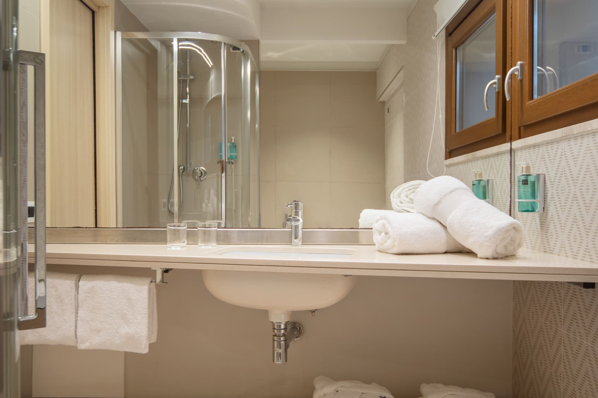 a bathroom with a sink and towels