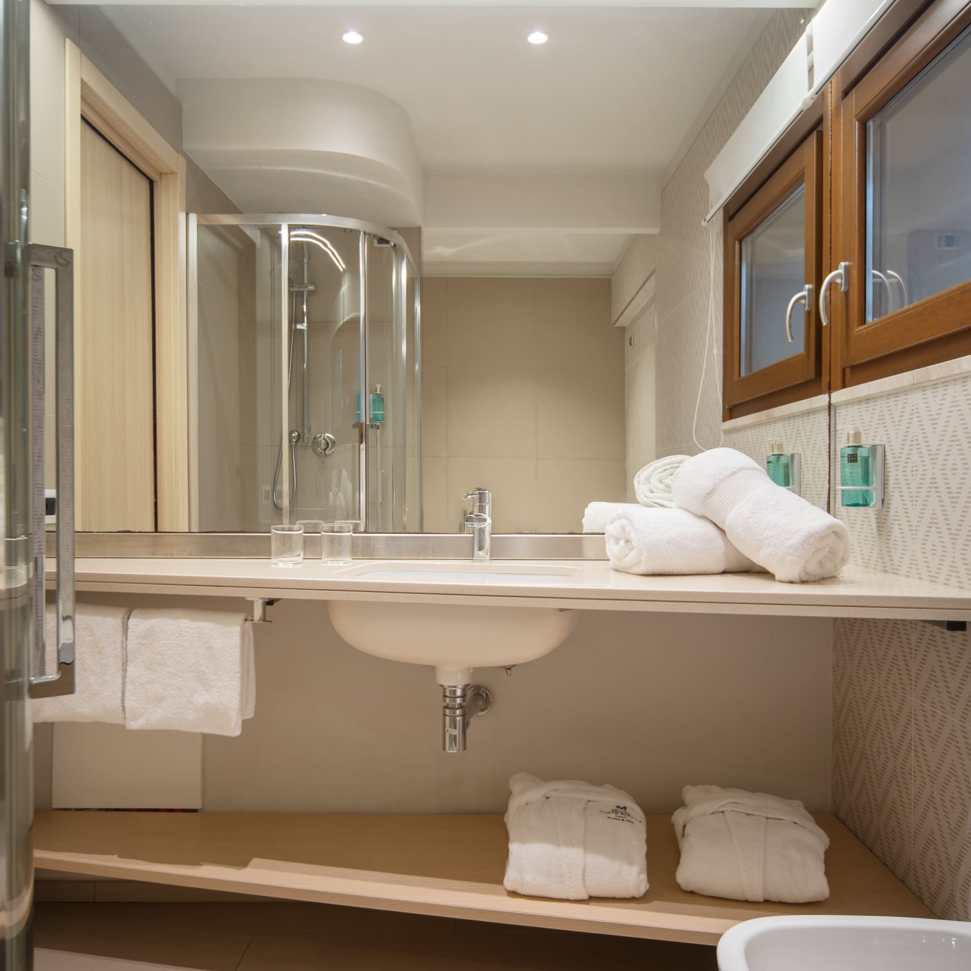 a bathroom with a sink and towels
