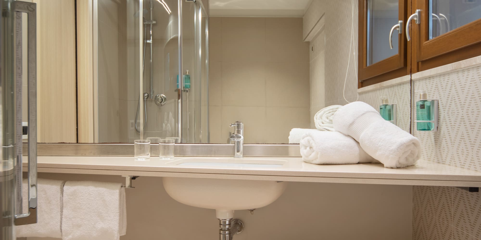 a bathroom with a sink and towels