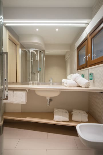 a bathroom with a sink and towels