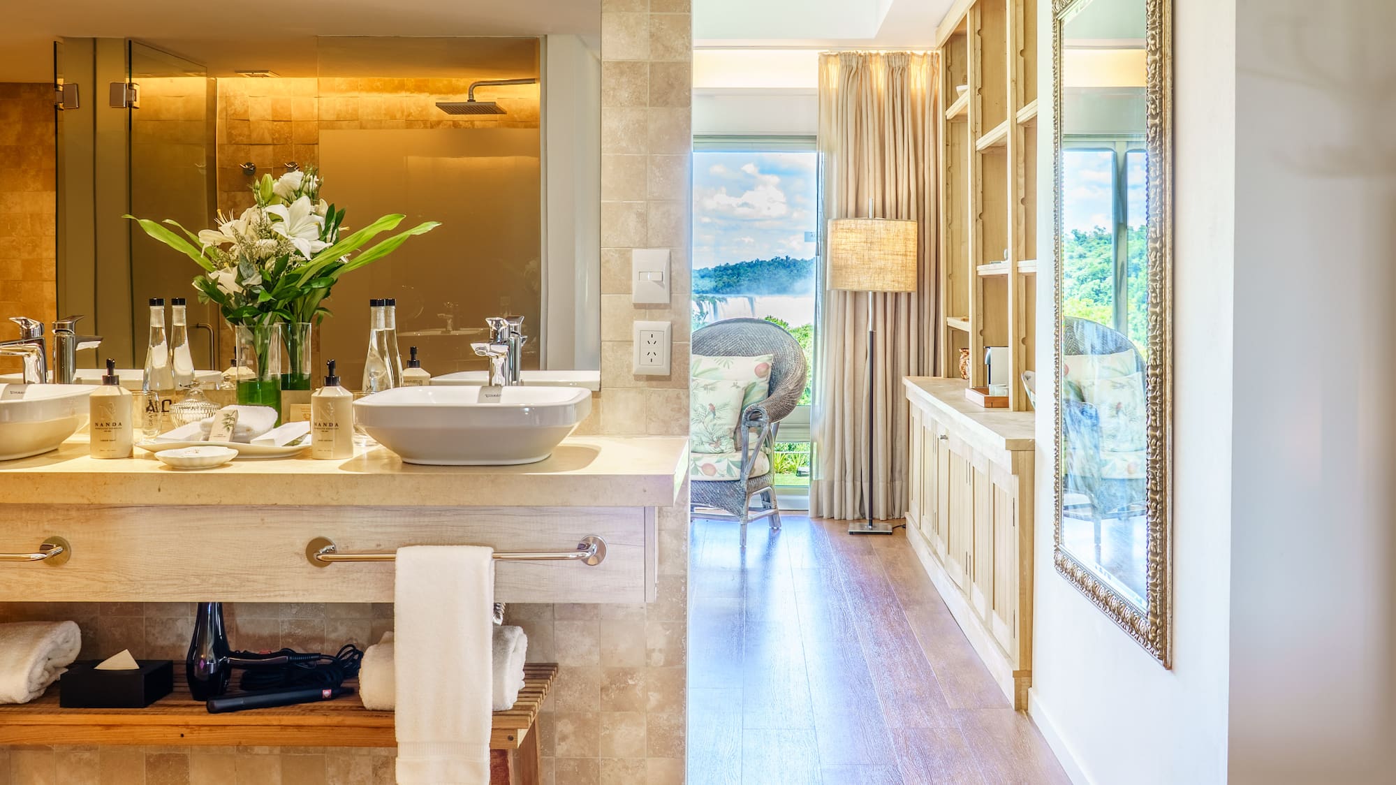 a bathroom with a tub and a large mirror