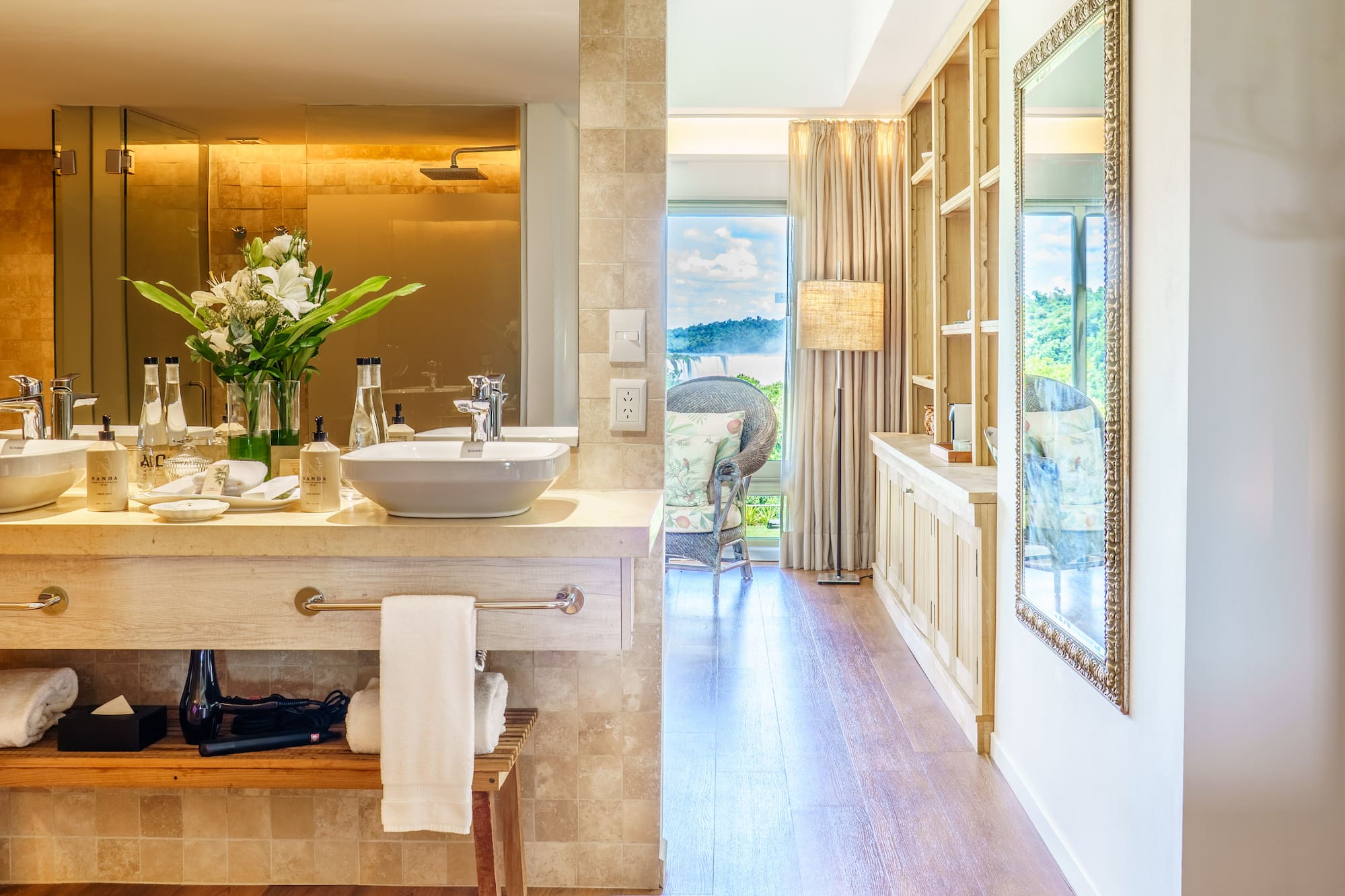 a bathroom with a tub and a large mirror